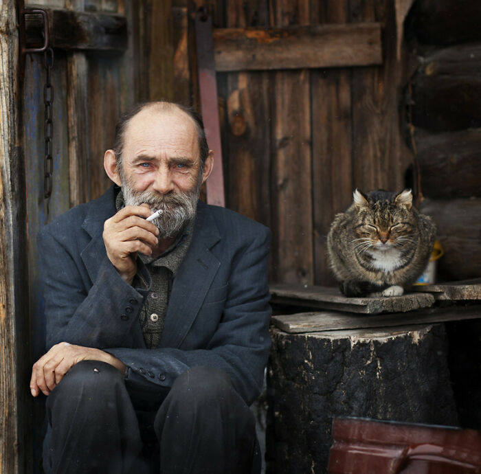 An Old Man With His Cat 