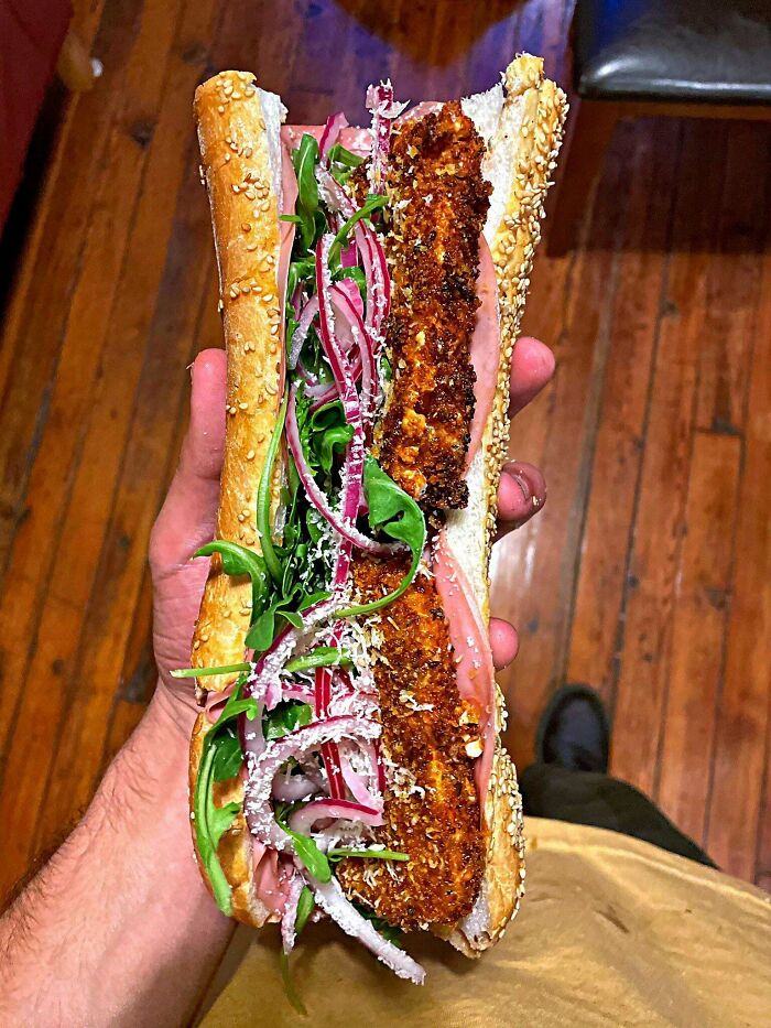 Mortadella, Hot Calabrian Fried Mozzarella, Arugula, Pickled Red Onion, Spicy Herb Mayo, Evoo, And Parmigiano Reggiano On A Seeded Roll