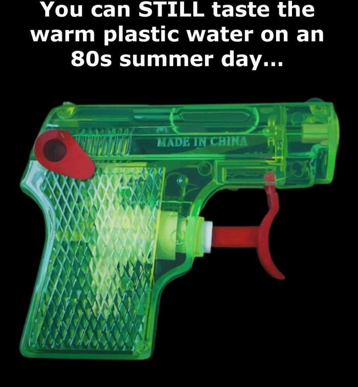 Transparent green toy water gun with red trigger, evokes nostalgia and humor for aging people.