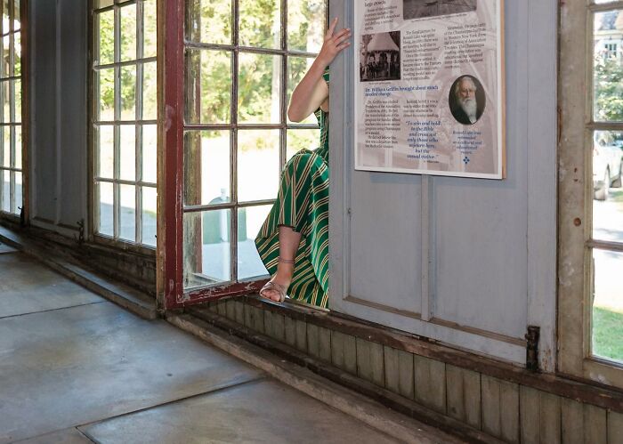 A Photograph Of A Woman Behind The Wall
