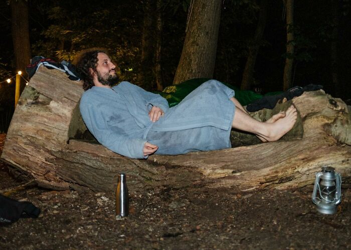A Photograph Of A Man Relaxing In His Robe