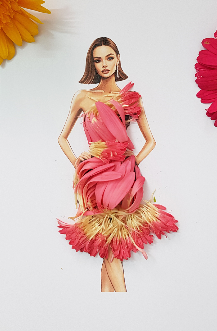 A drawing of a woman dressed in real flower petal gown