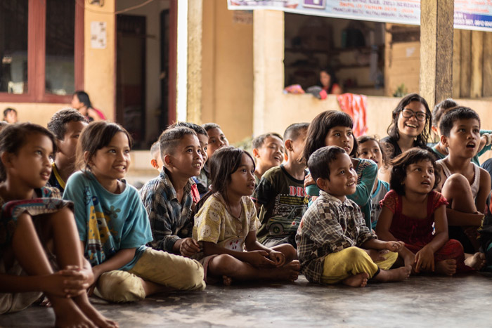 Group of childrens sitting on the ground