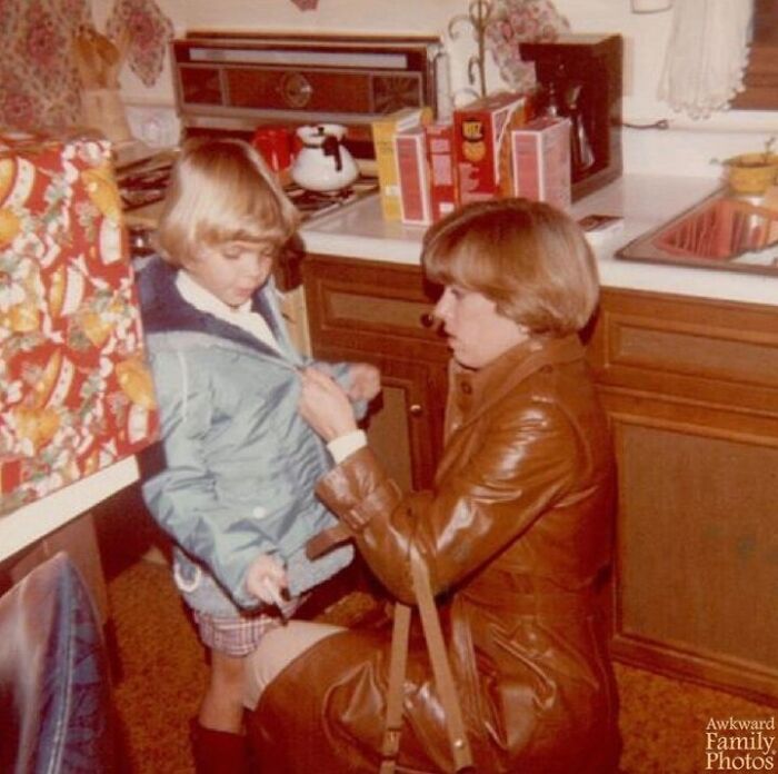 Holding My Mom's Cigarette While She Zips My Coat