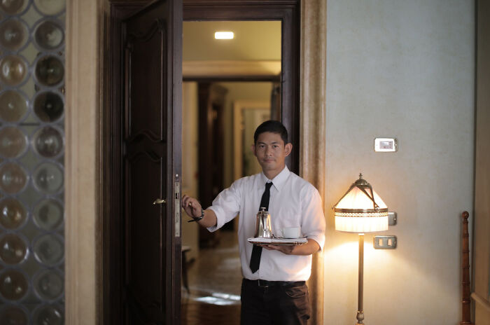 Waiter carrying a coffee 