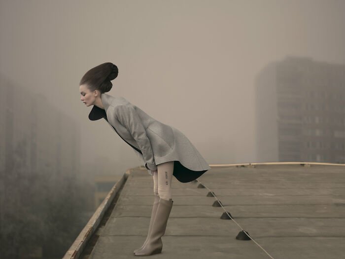 An image of a woman looking over the roof