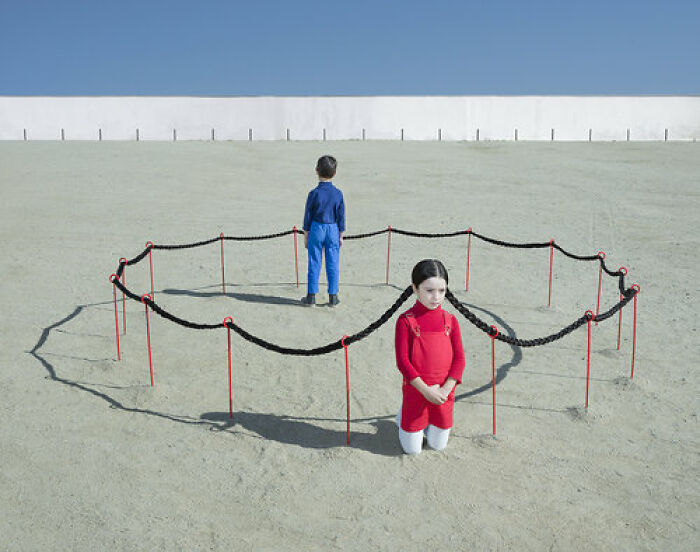 An image of a girl making a circle with her pigtails