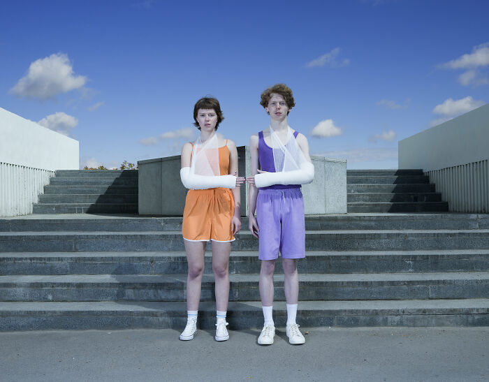 An image of a woman and a man with their arms wounded