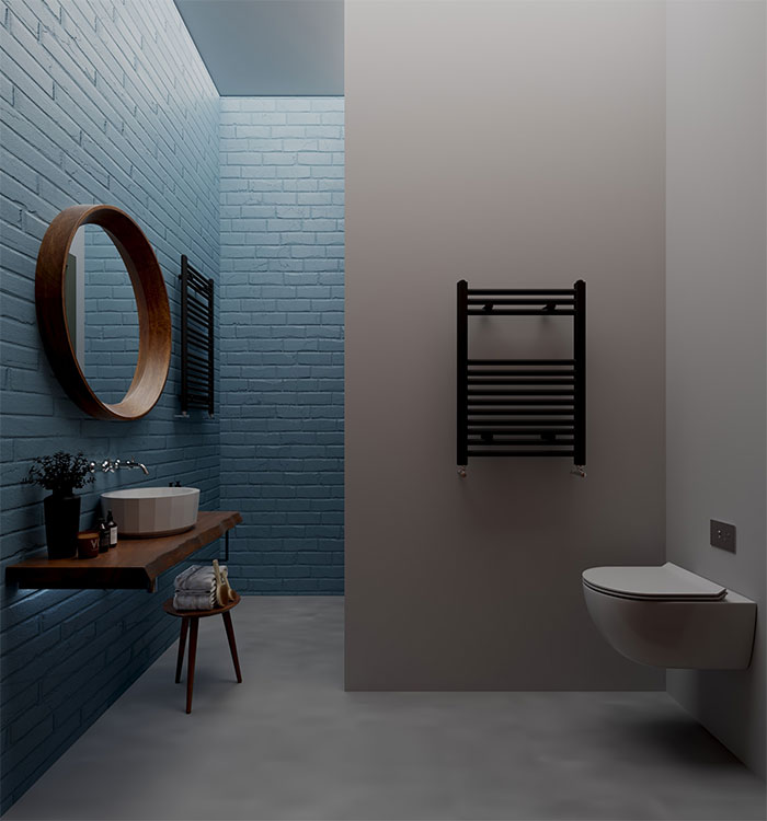 Bathroom with rectangular blue tile walls, floating wooden sink vanity, round mirror, and modern toilet design.