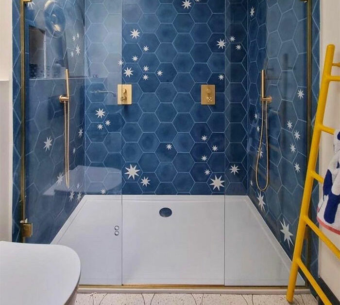 Bathroom with creative blue hexagon tiles featuring star patterns, showcasing beautiful bathroom tile design ideas for walls and flooring.