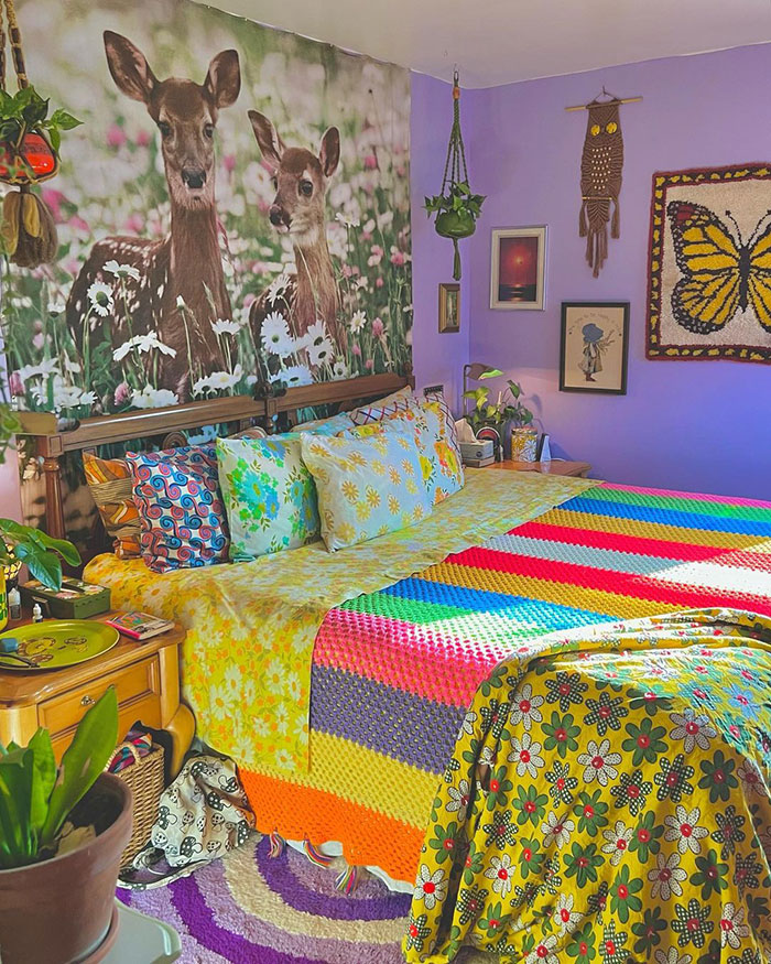 Vintage bedroom with colorful bedding and deer wall art showcasing cool and inspiring bedroom wall decor ideas.