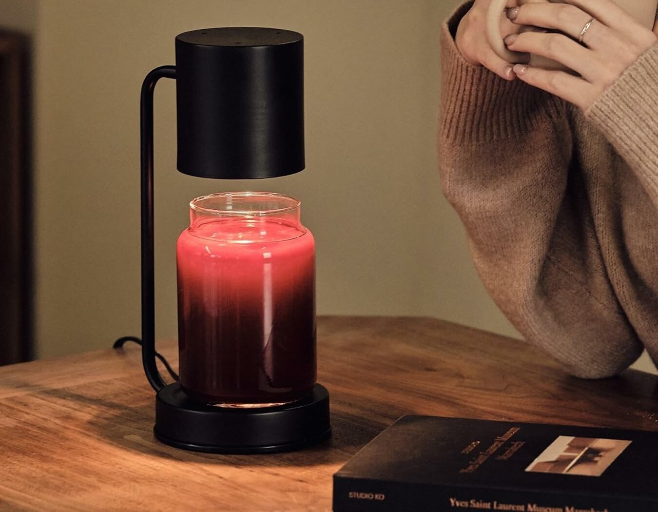 black candle warmer with red candle