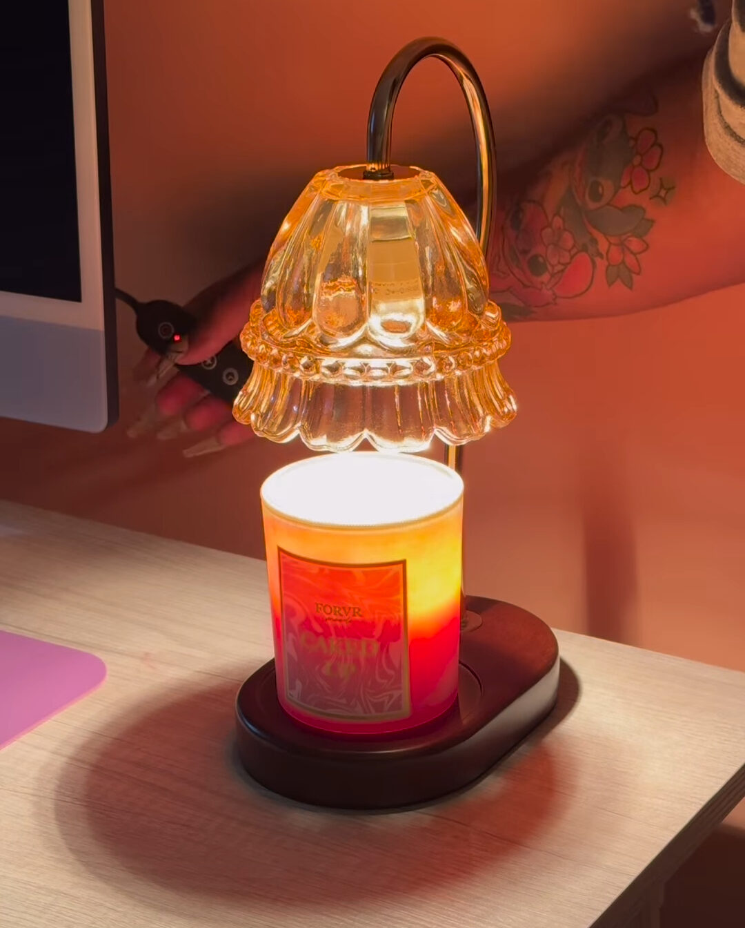 glass a candle warmer with a timer button