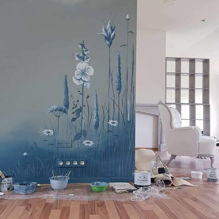 Blue chalk-painted wall with a flower design Blue chalk-painted wall with a flower design