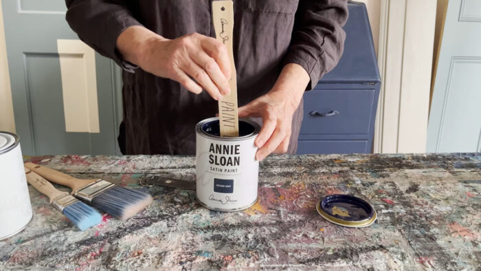 A person mixing Annie Sloan chalk paints A person mixing Annie Sloan chalk paints