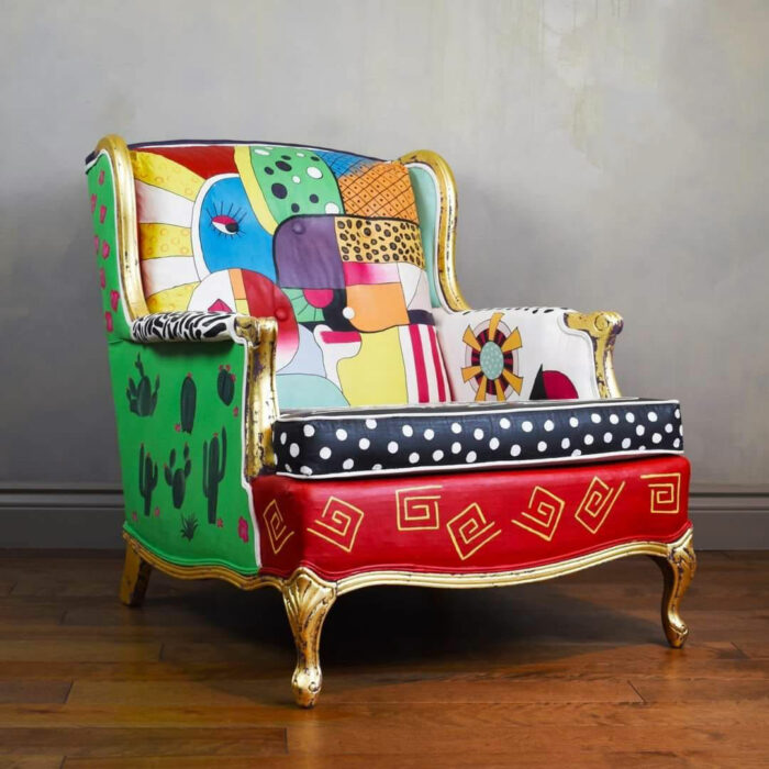 A colorful chalk-painted chair with multiple designs A colorful chalk-painted chair with multiple designs
