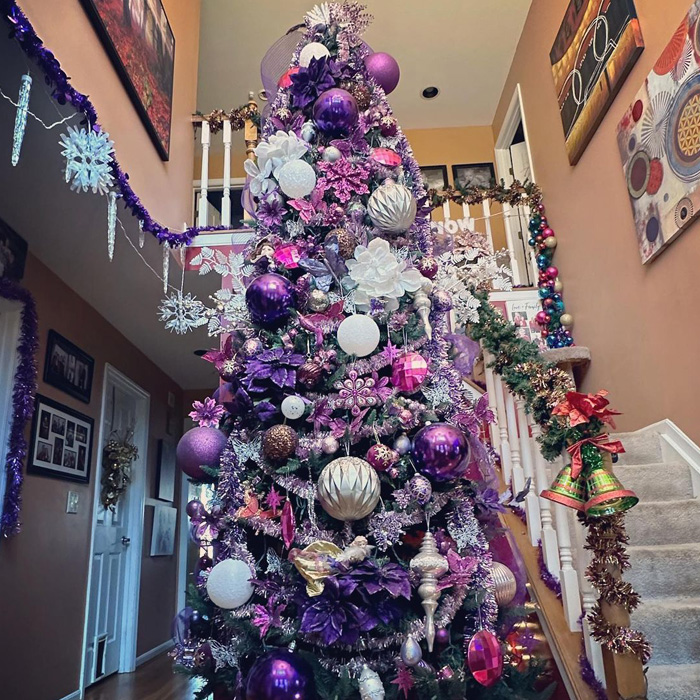 Purple Christmas tree decorated with various ornaments showcasing magical Christmas tree decorations and ideas for celebrations.