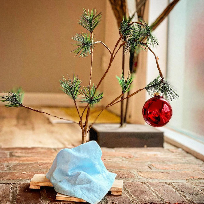 Charlie Brown small Christmas tree decorated with a single red ornament for magical Christmas tree decorations ideas.