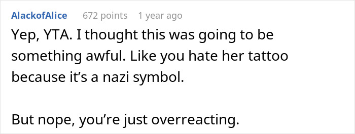 Comment thread with user discussing reactions to a huge tattoo on her chest and emotional family response.