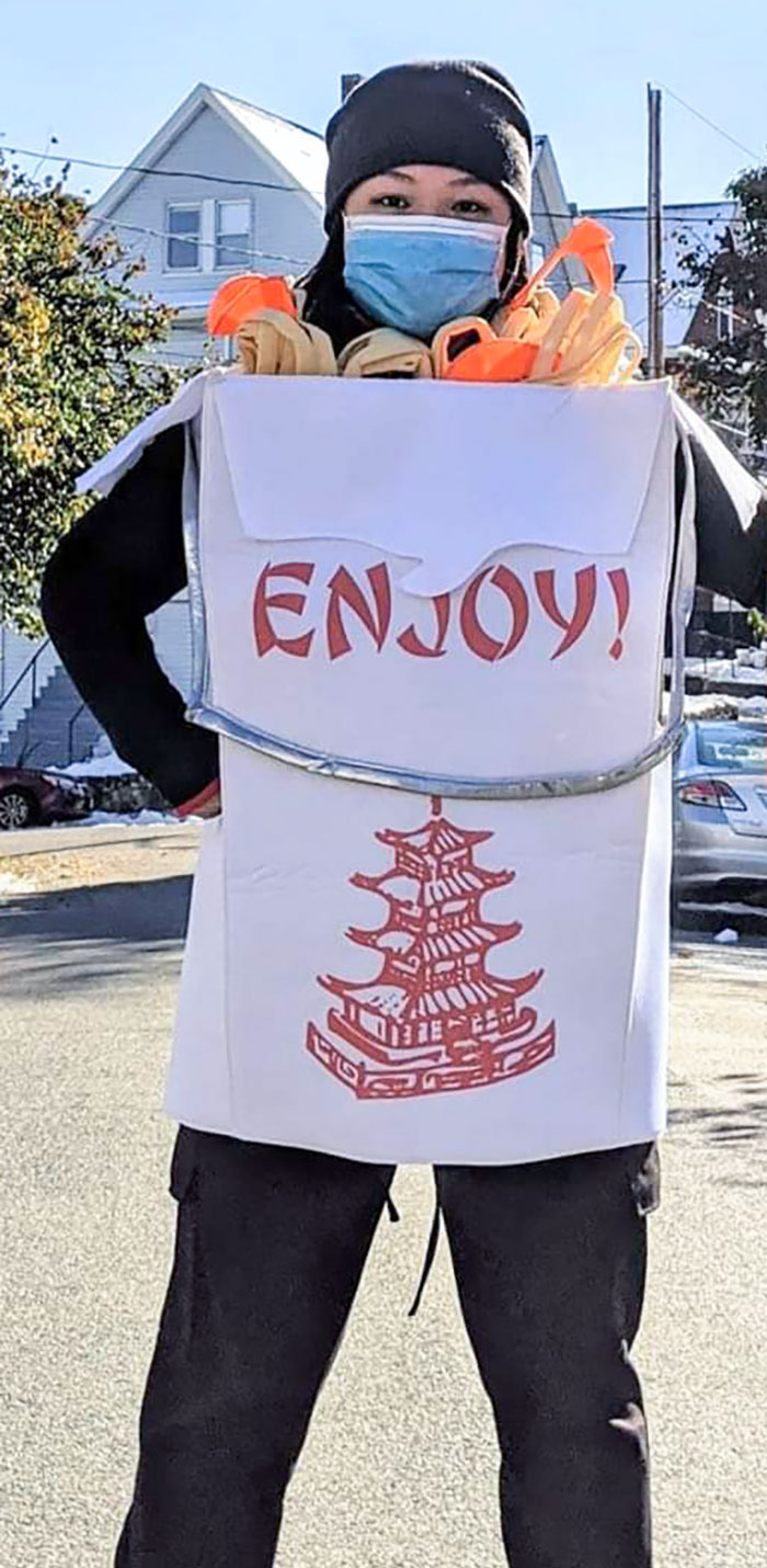 Person wearing clever Halloween costume designed as a takeout Chinese food container with chopsticks and noodles.