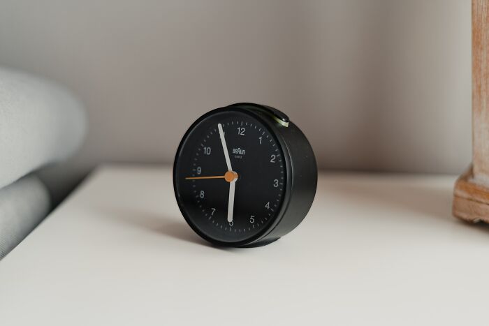 Black alarmclock on the table