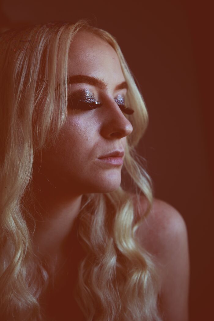 Blonde hair woman with colorful eyelids