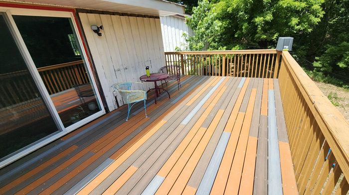 Backyard deck with multiple materials and colorful planks, creating creative backyard deck ideas to enhance outdoor time.