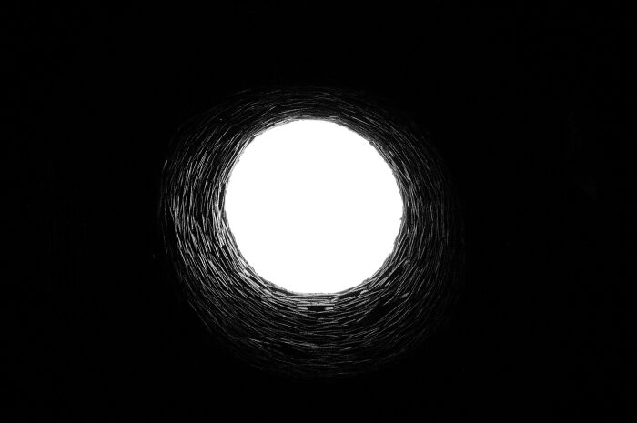 View from the bottom of a dark well looking up, prompting shower thoughts questions about perspective and depth.