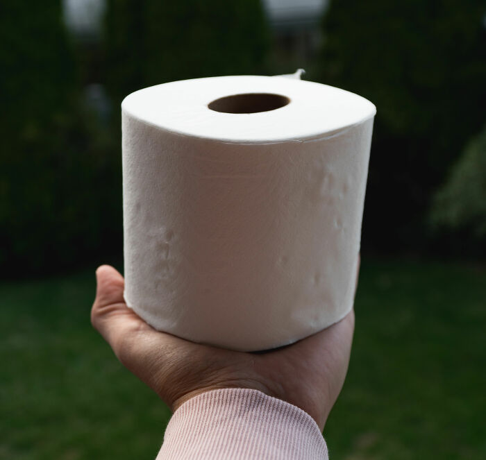 Man holding toilet paper