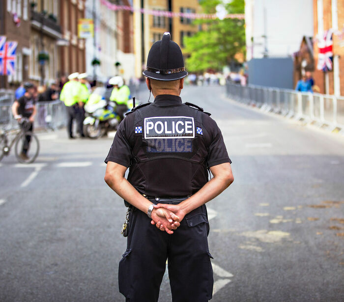 Police officer standing on road