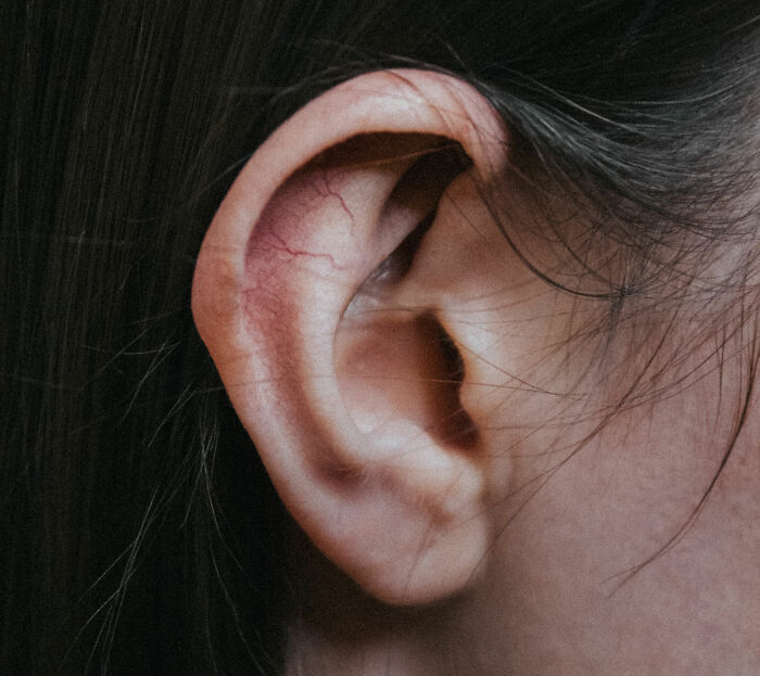 Woman with black hair ear