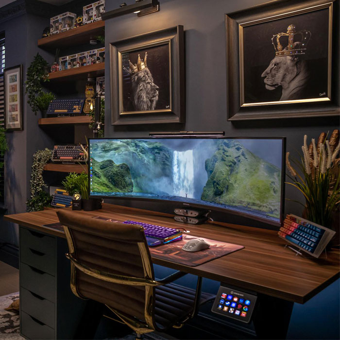 Wall art featuring crowned lion portraits displayed above a gaming desk in a stylish game room setup with dual monitors. Wall art featuring crowned lion portraits displayed above a gaming desk in a stylish game room setup with dual monitors.