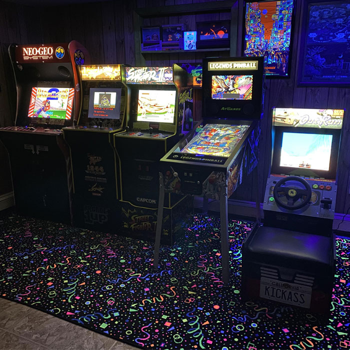 Dark game room featuring multiple vintage arcades and pinball machine, perfect game room ideas for gaming cave enthusiasts. Dark game room featuring multiple vintage arcades and pinball machine, perfect game room ideas for gaming cave enthusiasts.