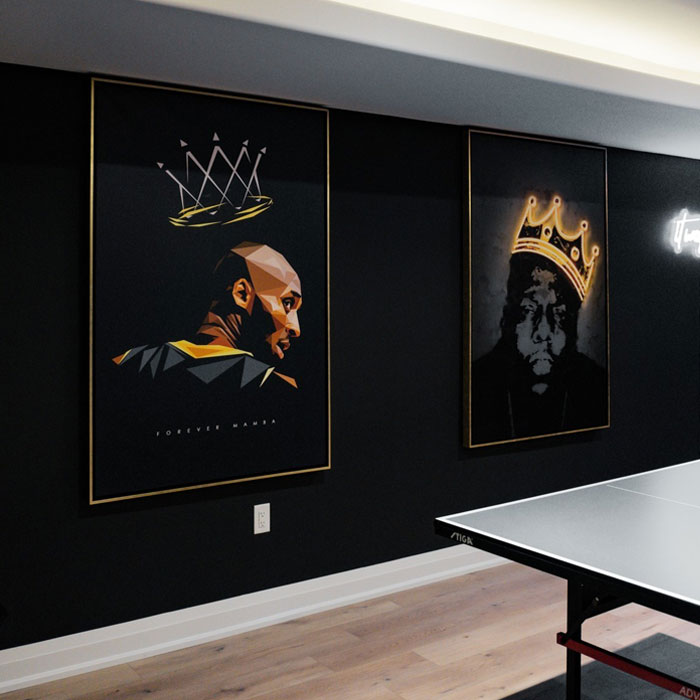 Two custom paintings featuring crowned figures displayed on a dark wall in a stylish game room setting. Two custom paintings featuring crowned figures displayed on a dark wall in a stylish game room setting.