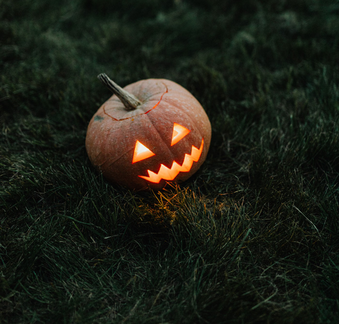 Lighted pumpkin in the field