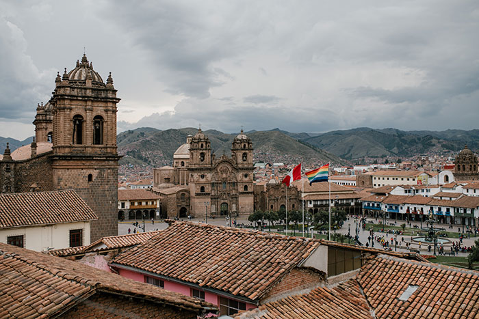 Cityscape of medieval church and houses with old tile roof