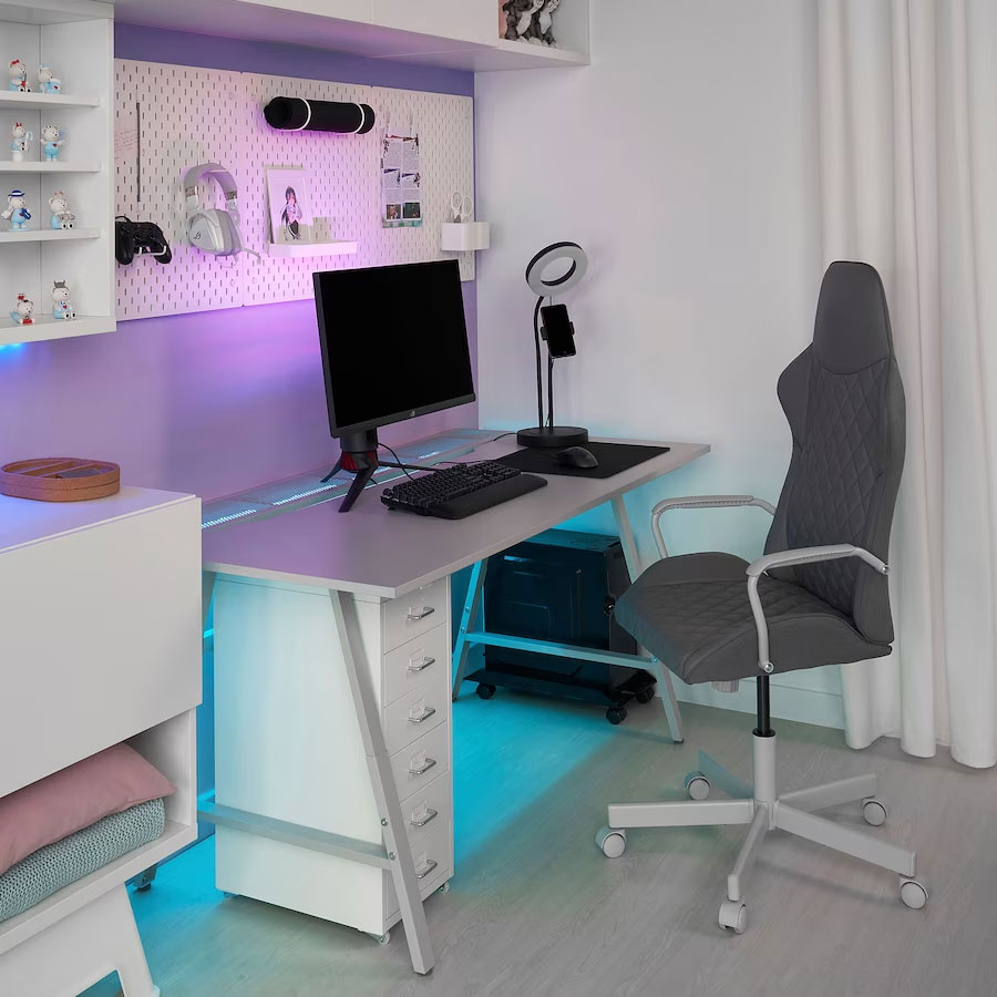 Modern home office setup with ergonomic chair, LED lighting, and organized desk for productive work process and home office ideas.