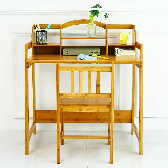 wooden desk with chair, storages and books