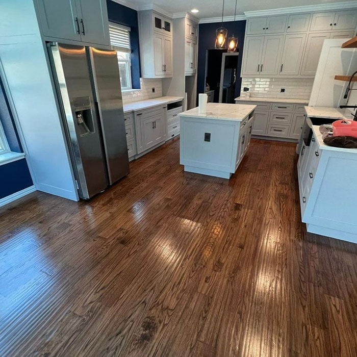English chestnut floor in a modern kitchen showcasing rich wood tones and Minwax stain colors for wood stain selection.