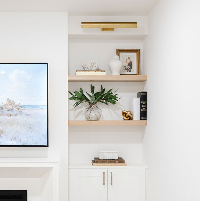 Pickled Oak Minwax stain color on wooden shelves in a modern white room corner with decorative items.