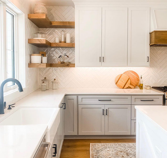 Bright bathroom kitchen featuring Weathered Oak wood stain colors on floating shelves and hood accents.