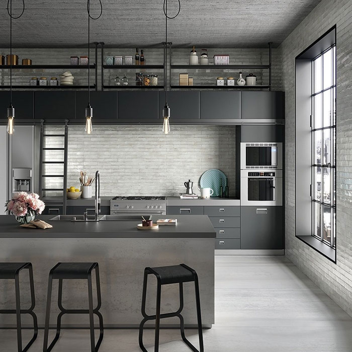 Spacious industrial style kitchen with modern grey cabinets and minimalist design for timeless kitchen look.