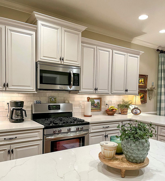 Bright kitchen featuring white subway tiles, modern cabinetry, and stainless steel appliances in a timeless kitchen design.