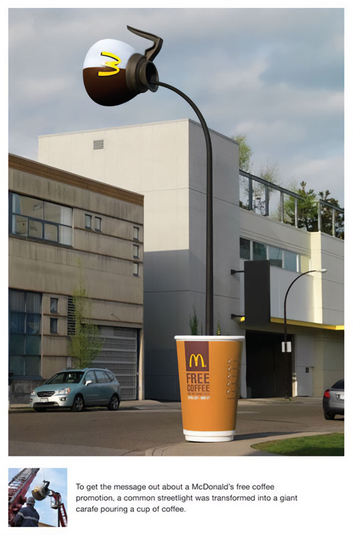 Clever advertisement showing a streetlight shaped like a coffee carafe pouring into a giant cup for a free coffee promotion.