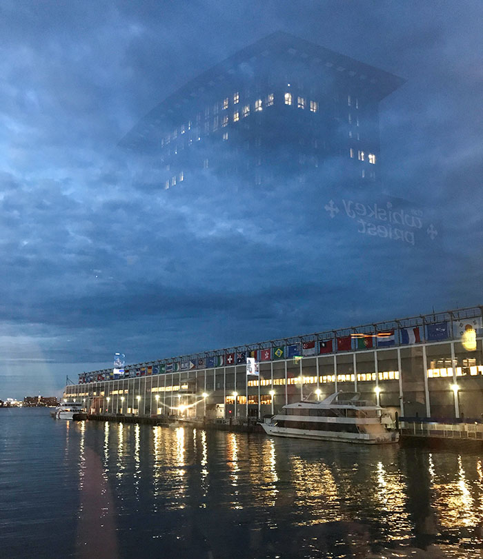 The Reflection Of This Building Makes It Look As If It's In The Sky