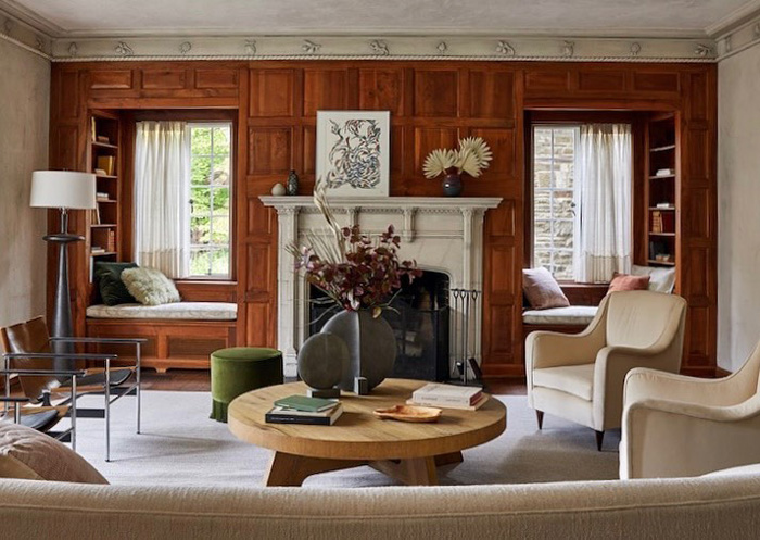 Living room with white fireplace and beige furniture showcasing old money interior design style and elegant decor. Living room with white fireplace and beige furniture showcasing old money interior design style and elegant decor.