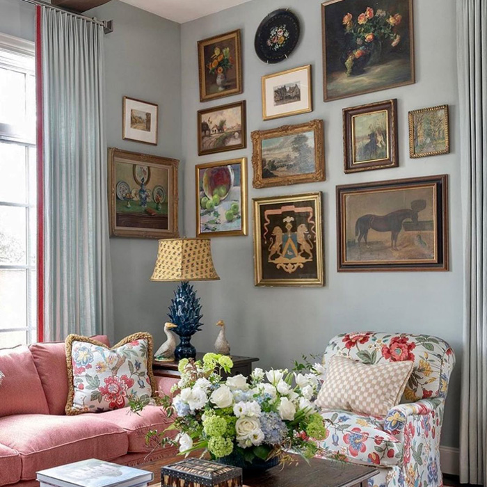 Cozy living room showcasing old money interior design with floral chair, vintage paintings, and elegant decor accents. Cozy living room showcasing old money interior design with floral chair, vintage paintings, and elegant decor accents.
