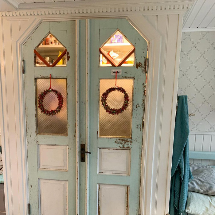 Green and white wooden pantry door 