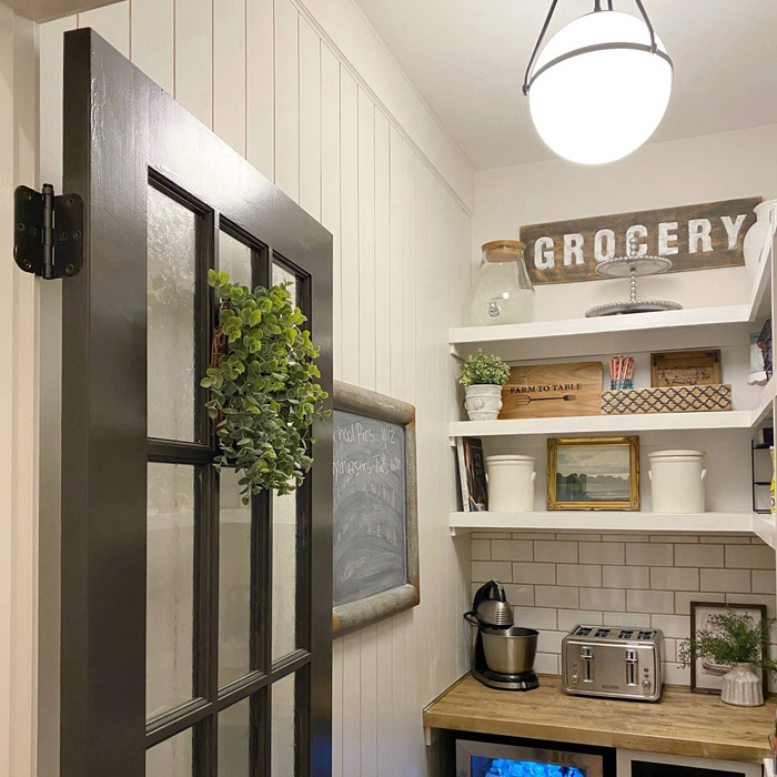 Storage with shelves and jars on it 