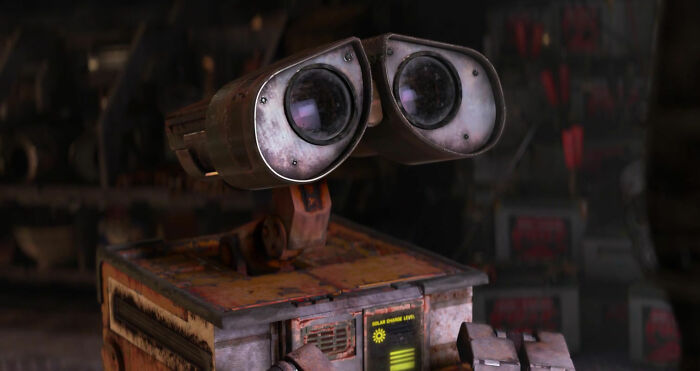 Wall-E looking at TV